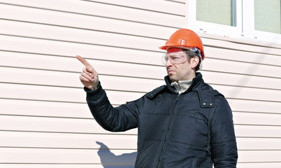 Worker on a construction site in winter