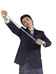 a young businessman holding a chain