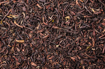 Background of dry black tea with flavors
