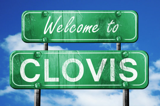 clovis vintage green road sign with blue sky background