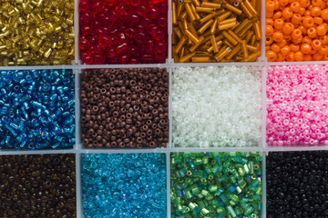 Multicolored beads in a plastic container
