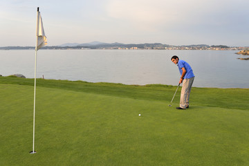 Young man playing golf