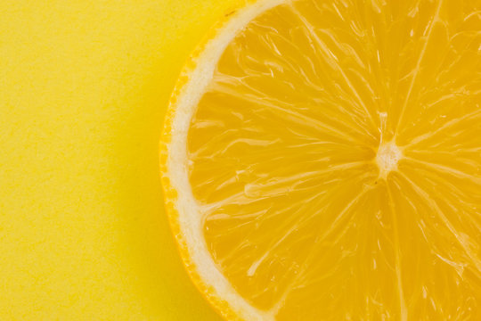 lemon on yellow background closeup