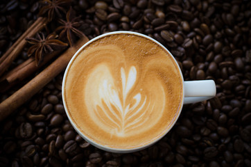 latte art coffee on coffee beans background