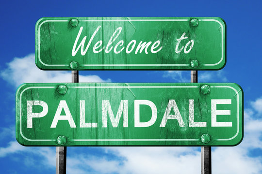 palmdale vintage green road sign with blue sky background