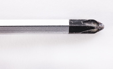 screwdriver in macro on white background