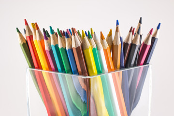 colored pencils in a glass