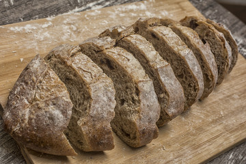 wheat flour with a fresh bread cutted into slices