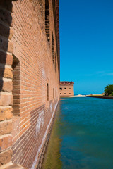 Standing on the moat which surrounds Fort Jefferson Civil War Fort and a prison for confederate soldiers