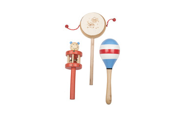 Wooden rattles and drum on a white studio background