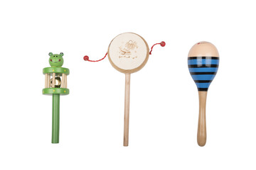Wooden rattles and drum on a white studio background