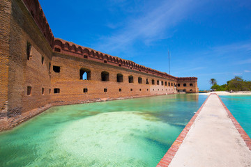 The crystal clear waters of the Gulf of Mexico surround Civil War Historic Fort Jefferson in the Dry Tortugas makes a great place for swimming and snorkeling - obrazy, fototapety, plakaty