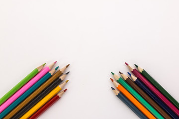 colored pencils on white background