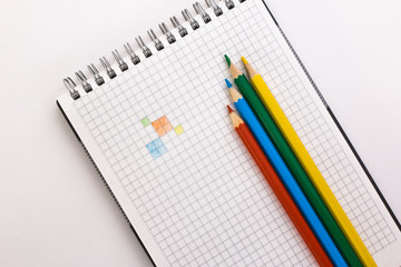 notebook and colored pencils