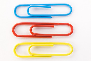 blue red and yellow paper clips macro