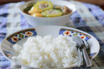 Cooked rice in white dish