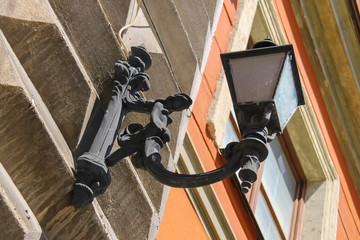 Vintage lantern on the wall in city centre