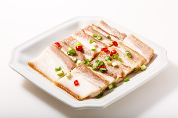 Cooked bacon On the white plate