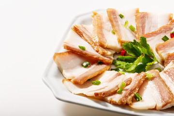 Cooked bacon On the white plate