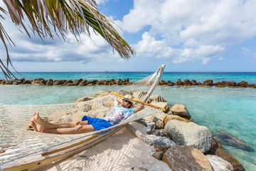 Man relaxing in a hammock