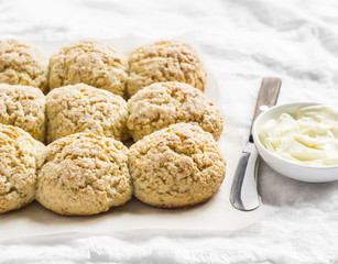 Orange oatmeal scones on a light background