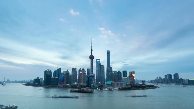 shanghai skyline in nightfall with busy huangpu river, time lapse.
