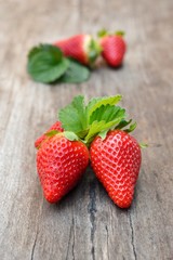 Strawberry Ripe red strawberry on wooden table. Fresh strawberry on wood background. 