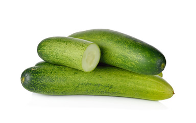 whole and cut fresh cucumbers on white background