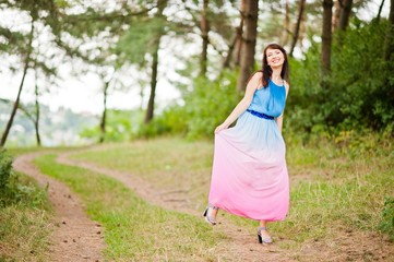 Young beautiful and cute girl posed at pine forest