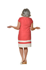 Senior woman in bright dress