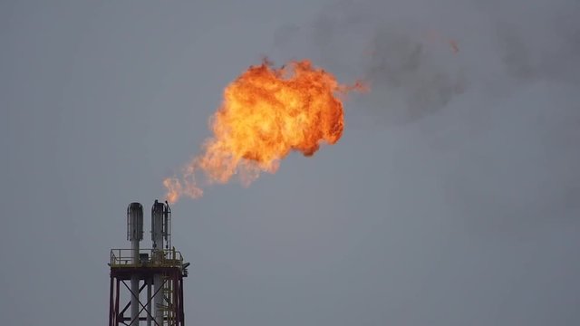  refinery fire gas torch on sky background