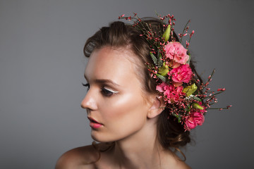 Tender beauty portrait of bride with roses wreath in hair