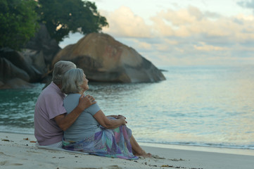 elderly couple rest at tropical resort