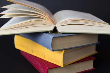 Stack of books on black background