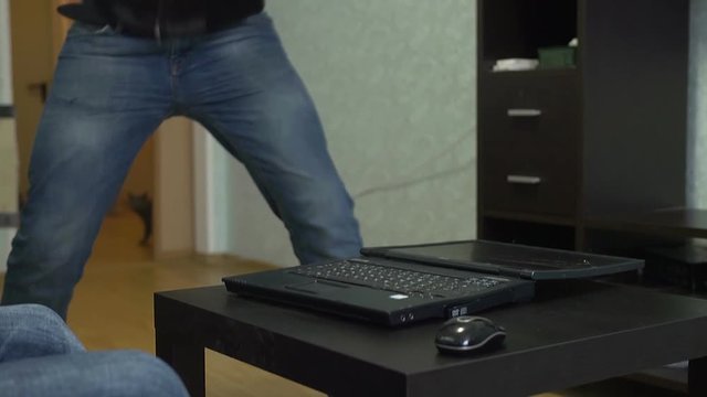 Man smashes laptop