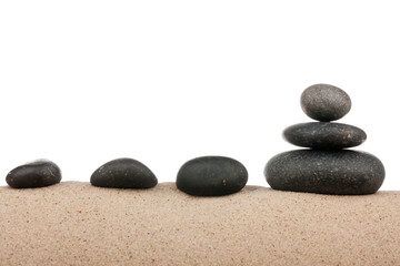 Fototapeta na wymiar Zen stones pyramid on sand beach, meditation, concentration, relaxation, harmony, balance