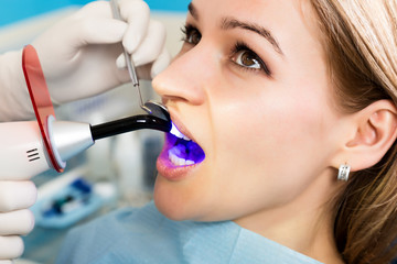 The reception was at the female dentist. Doctor examines the oral cavity on tooth decay. Caries...