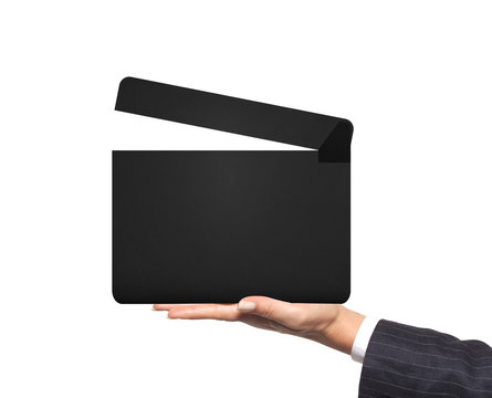 Movie clapperboard in woman hand isolated on white background