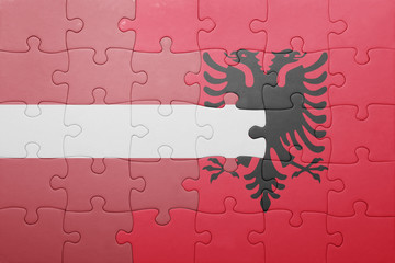 puzzle with the national flag of latvia and albania