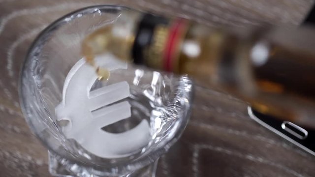 Pouring a scotch whiskey on the ice Euro symbol