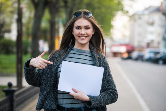 Pretty Girl Holding A White Sheet