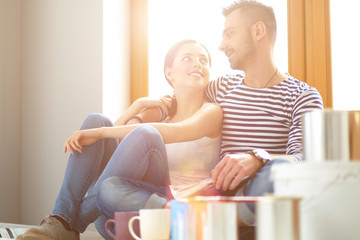 Portrait of young couple moving in new home