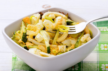 Salad with squid, cucumbers and eggs.