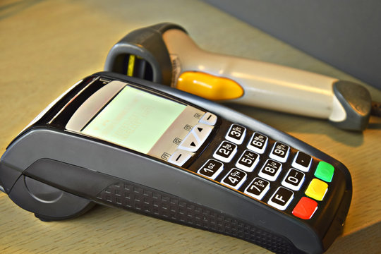 Bank terminal with hand reader of barcode
