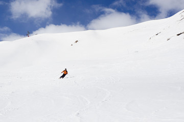 Fototapeta na wymiar skier going down of a mountain very fast