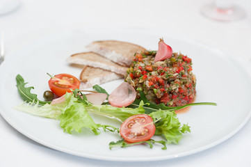 Closeup of Aubergine Pate served on a white plate