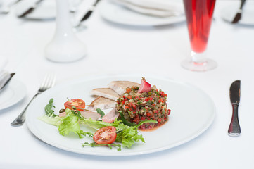 Aubergine Pate Served on a Restaurant Table with Glass of Fruit Salad