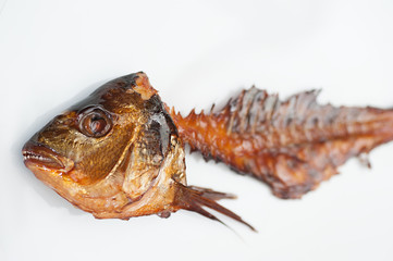 Smoked Fish Bone on a White Plate