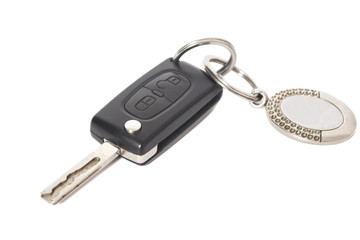 Remote control car key with metal keyring on isolated white back