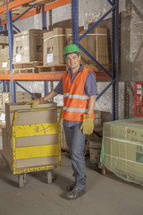 Fototapeta na wymiar Workers In Warehouse Preparing Goods For shipping